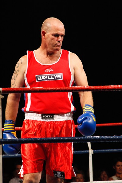 Victorious Bayleys sales consultant Mark O'Loughlin delivers another stinging blow against opponent Ta Karati of Harcourts during the charity fight night. 